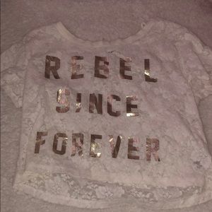 White lace top with gold lettering